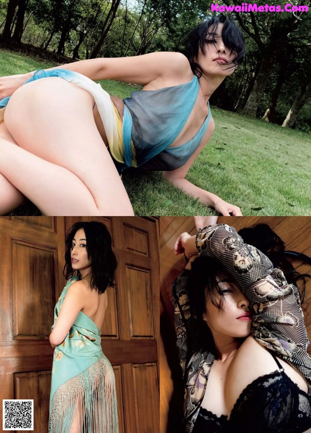 A woman laying on the grass next to a door.